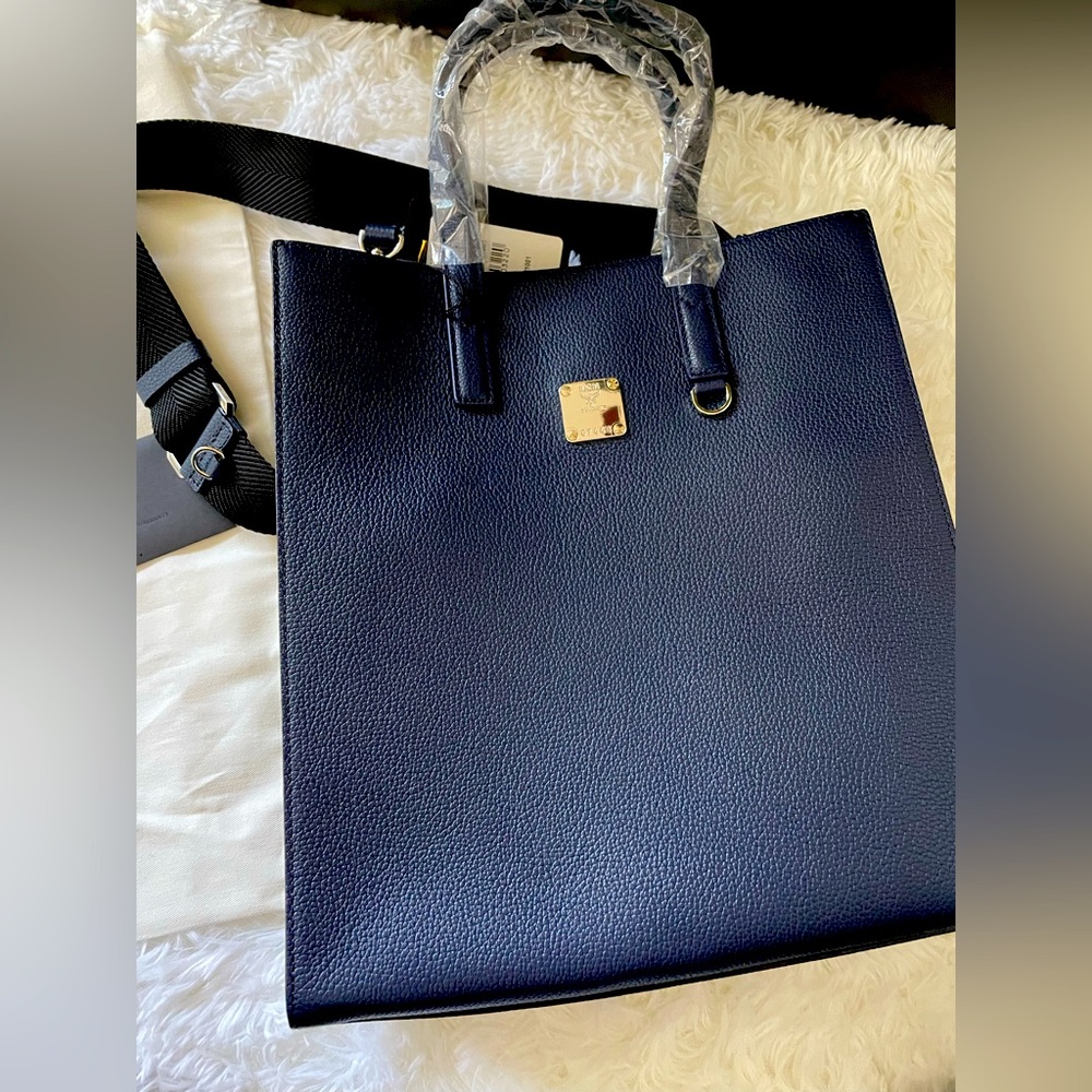Used once like Brand new  MCM navy handbag/sling  unisex